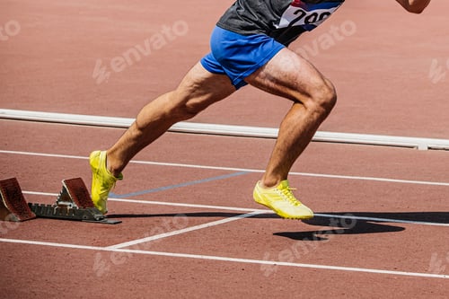 Preview: legs sprinter runner start from starting blocks running in track