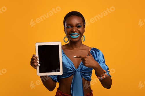 Preview: Stylish black lady showing digital tablet with empty screen