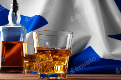 Preview: Bottle of whisky against flag of Scotland
