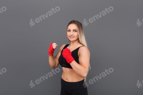 Preview: Confident Woman in Black Sports Bra and Wraps