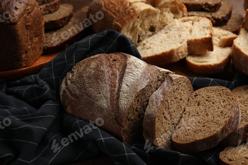 Preview: Different types of fresh bread on table, closeup
