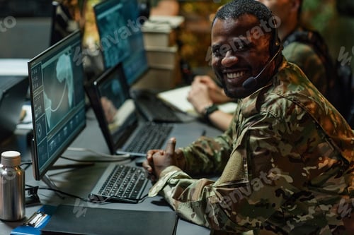 Preview: Happy young African American male military officer with headset