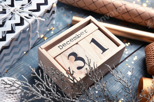 Preview: Wooden block calendar and festive decor on table, closeup
