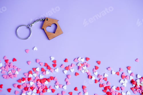 Preview: Valentine's day concept many small hearts and keychain on purple background