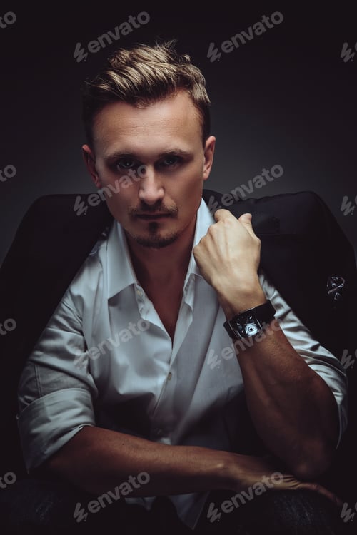 Preview: Man in white shirt and black jacket.