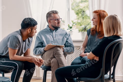 Preview: Counselor talking to his patients during treatment in an office