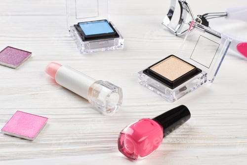 Preview: Make up cosmetics on wooden background.