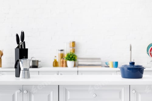 Preview: modern white kitchen interior with coffee pot, pot and knives on table