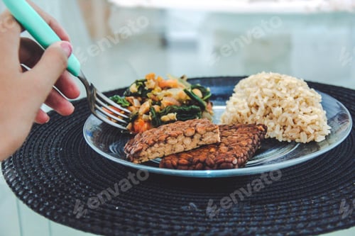 Preview: Colorful Plate with Rice, Vegetables, and Tempeh