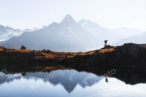 Preview: Tourist hiking near Lac de Cheserys lake in French Alps