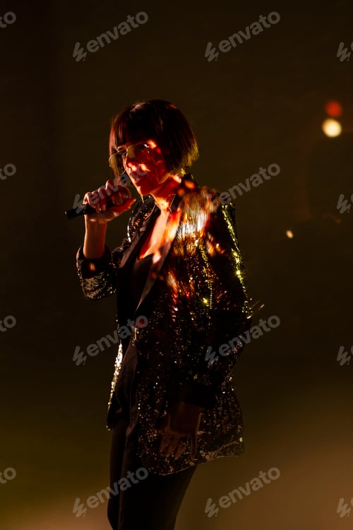Preview: Stylish woman singing on stage