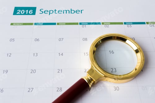 Preview: September calendar from 2016 with a magnifying glass on the date