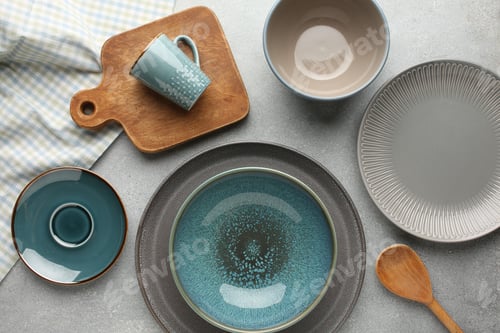 Preview: Set of kitchenware on grey marble table near light wall. Modern interior design