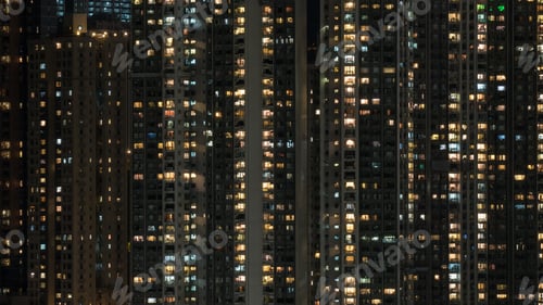 Preview: Window lights in high-rise apartment block at night
