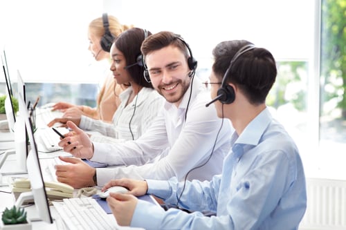 Preview: Happy male technical support operators having friendly chat at call centre