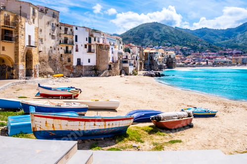 Preview: Fishing boats on beach of Cefalu, medieval town on Sicily island, Italy