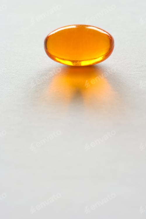 Preview: Detail of orange pills in packaging and isolated