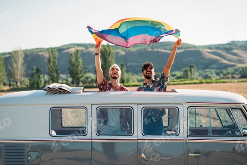 Preview: Gay couple in van holding LGBT flag