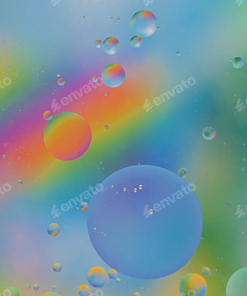 Preview: Abstract oil bubbles on a multicolored background. Macro photography of bubbles on the water surface