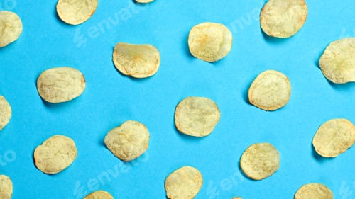 Preview: Potato chips flying in air cutout. Vegan beer snack on blue. Crispy veggie chip, falling creative co