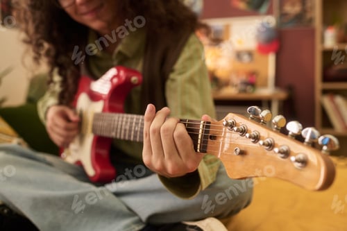 Preview: Playing Electric Guitar with Couch in Background