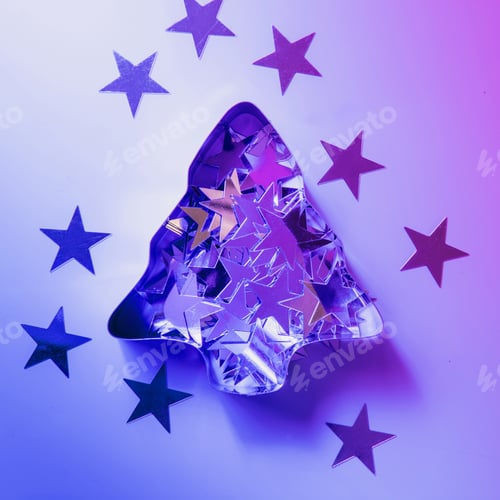 Preview: Christmas tree cutter with sparkling stars on neon pink and blue rays. Creative Xmas pattern.
