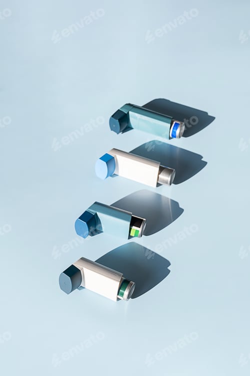 Preview: Asthma Inhalers Aligned on Serene Blue Backdrop. Medical Concept