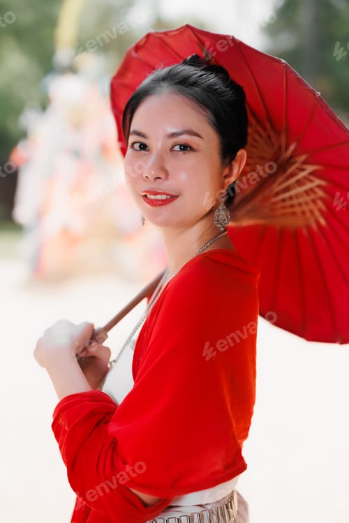 Preview: Northern Thai Chiangmai lanna style beautiful women with paper umbrella at wat ton kwen