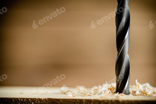 Preview: Piece of wood is drilled with shavings.