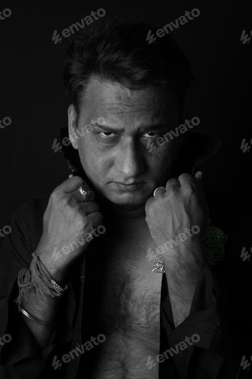 Preview: Vertical portrait of a middle-aged South Asian man in grayscale
