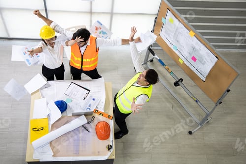 Preview: Success group engineers with throw the document after closing the project.