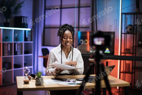 Preview: Portrait of confident experienced smart african american office manager recording video vlog