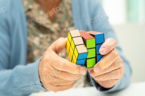 Preview: Bangkok, Thailand August 14, 2023 Alzheimer disease AD, Asian elderly woman patient playing Rubik