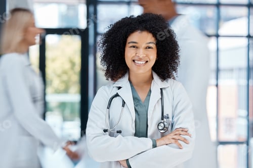 Preview: Portrait of happy doctor with smile in a hospital ward with motivation and success in the medical i