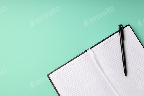 Preview: Blank notebook with pen on mint background