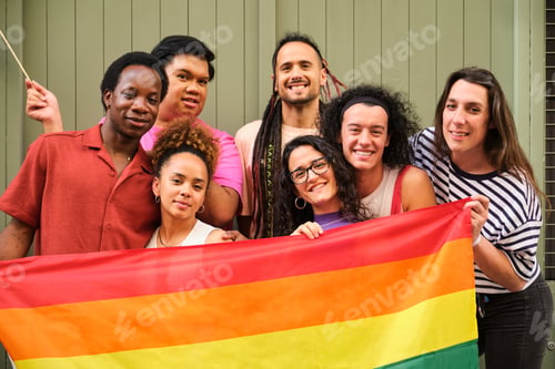 Preview: A group of people are holding a rainbow flag and smiling.