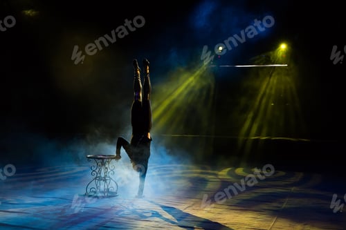 Preview: Acrobat performs a difficult trick in the circus.