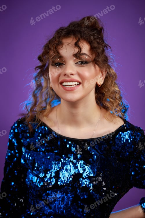 Preview: Close-up photo of young lady laughing and standing on purple background