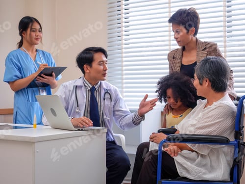 Preview: At hospital room patient sit on wheel chair looking laptop computer listen doctor explanation