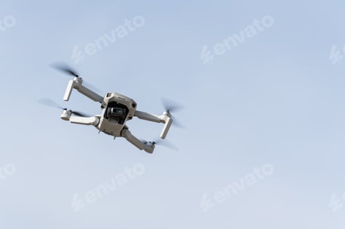 Preview: Drone flying with the light blue sky on the background