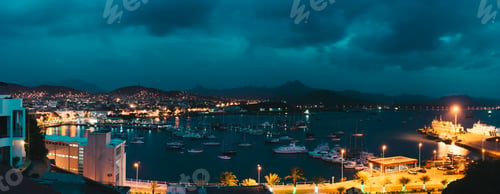 Preview: Cape Verde, Sao Vicente Island. Twilight panoramic view of Mindelo city port town with many boats in