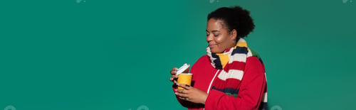 Preview: Stylish plus size african american woman enjoying a warm drink in autumn setting