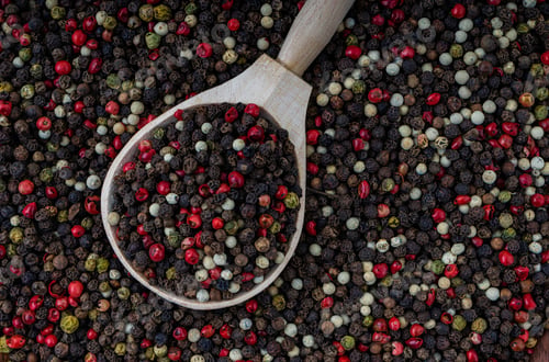Preview: Five Peppercorn mix five varieties in a wooden spoon for a food background