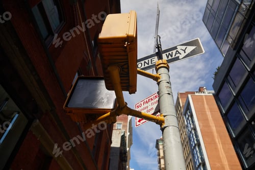 Preview: low angle view of street pole with road signs and traffic lights in new york city, urban signage