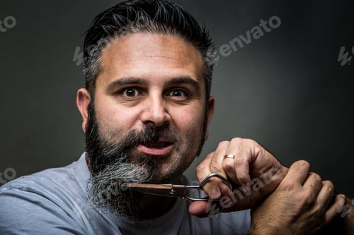 Preview: Expressive barber cutting beard