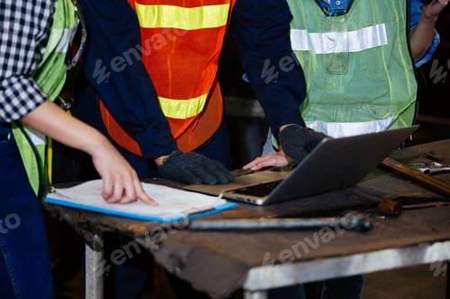 Preview: Group of construction worker working on document at the factory
