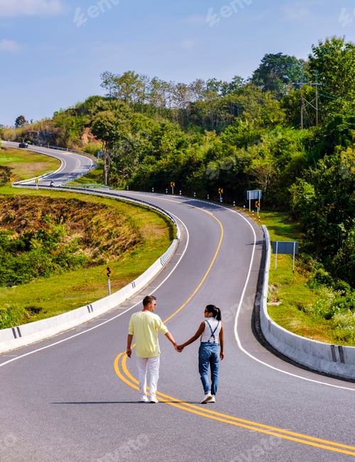 Preview: A couple walking at a curved road in the mountains of Nan Thailand, Road nr 3 country road