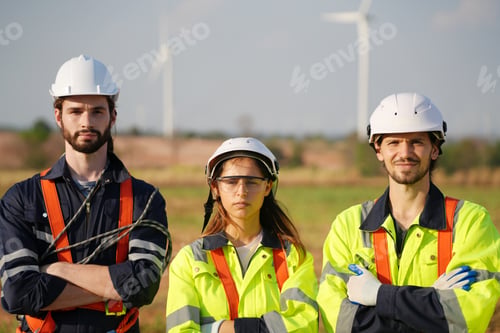 Preview: Sustainable energy industry - Engineers working at alternative renewable wind energy farm
