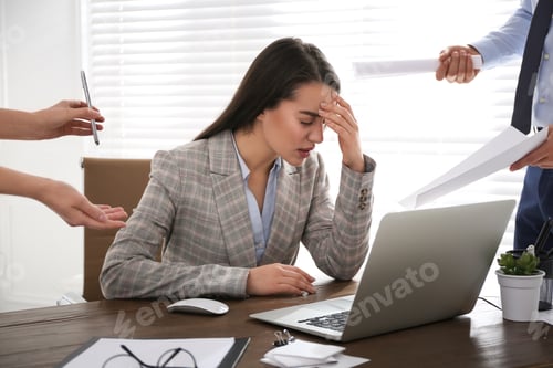 Preview: Businesswoman stressing out at workplace in office