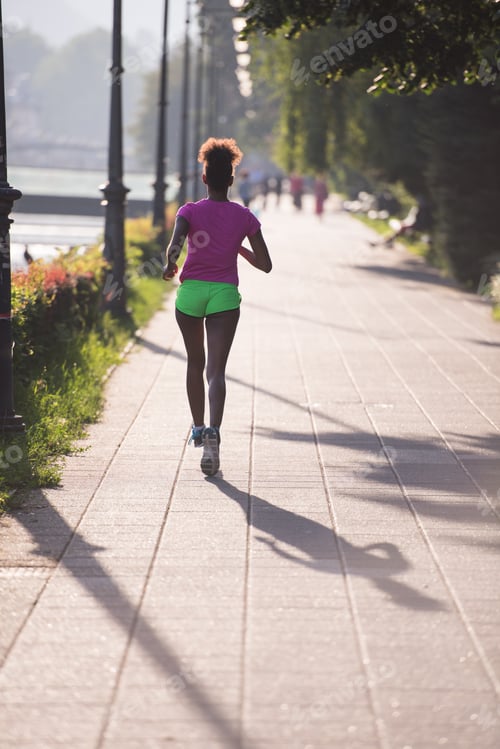 Preview: african american woman jogging in the city